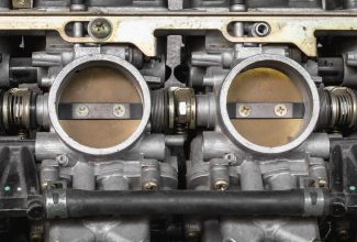 Part of old carburetor for motorcycle